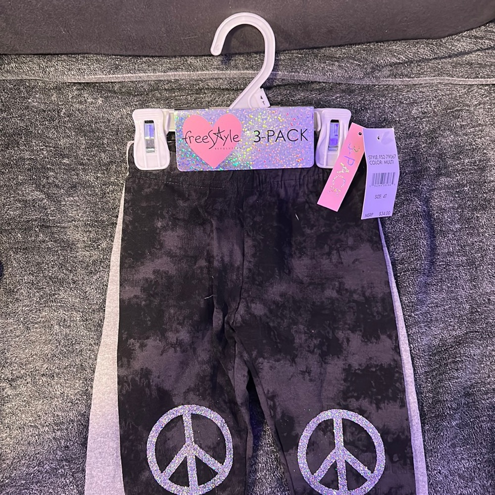 A three pack of girls, stretchy yoga, type pants